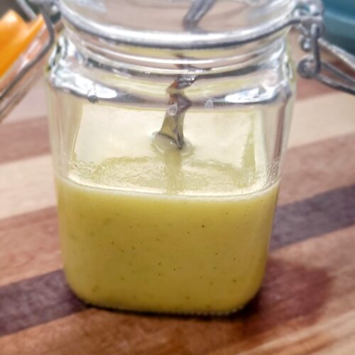 a jar containing a lemon vinaigrette.