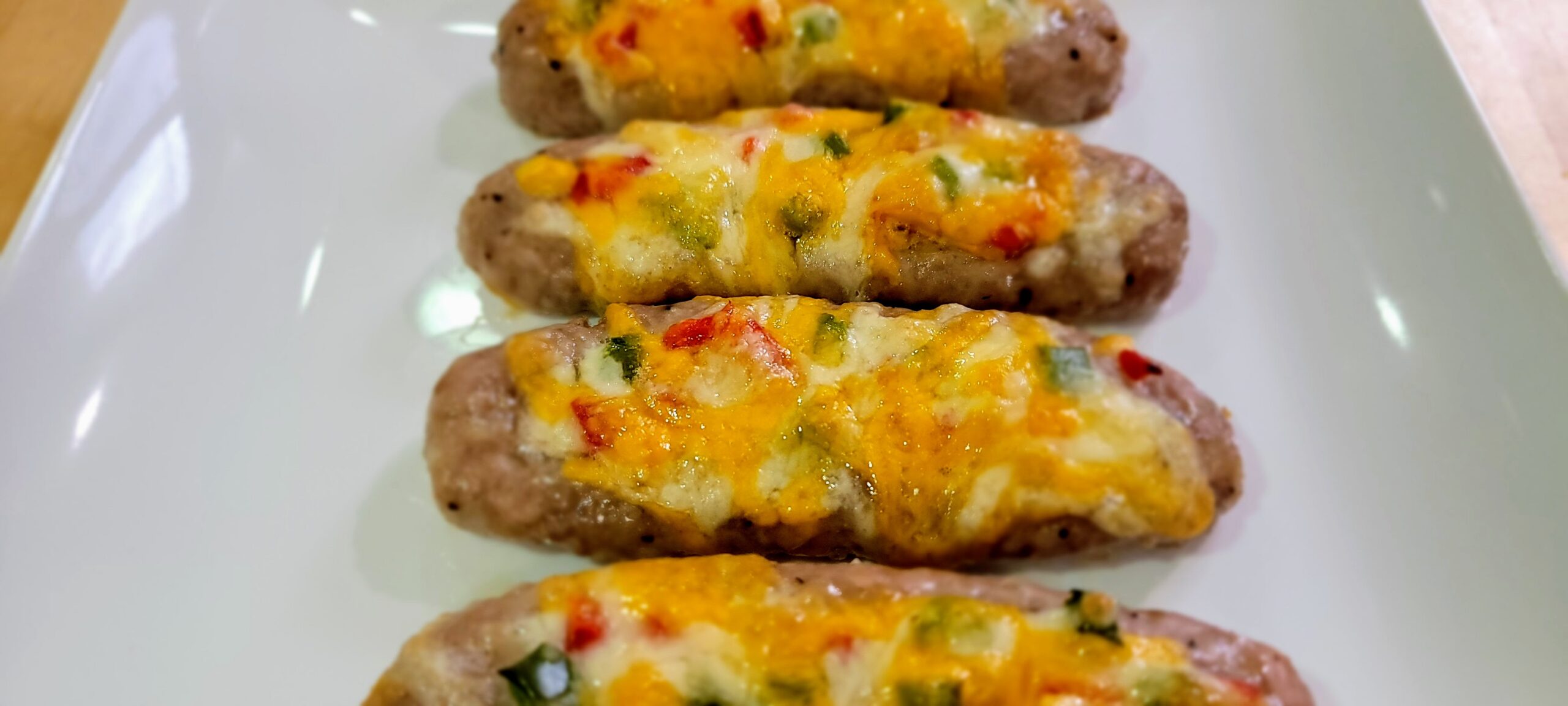 Cheese covered smashed sausages