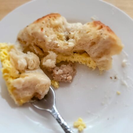 a small plate with biscuits and gravy casserole